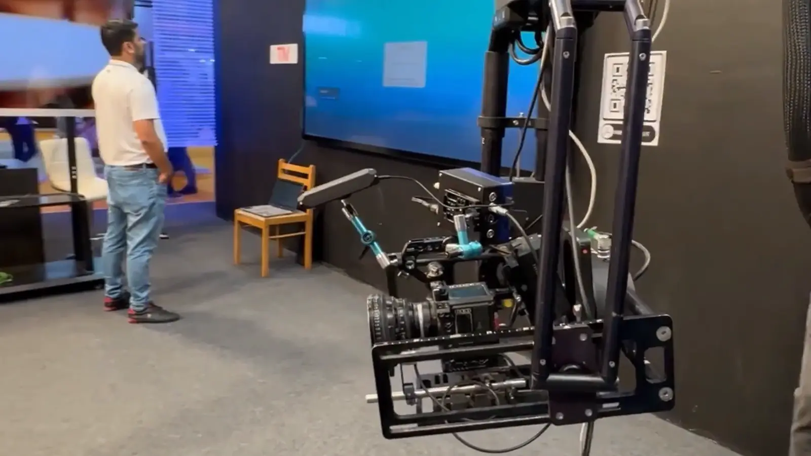 Cinema camera on a robotic rig in an LED stage